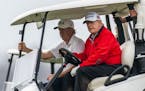 President Donald Trump, drives his golf cart as he plays golf at the Trump National Golf Club in Sterling, Va., Saturday, Nov. 21, 2020.