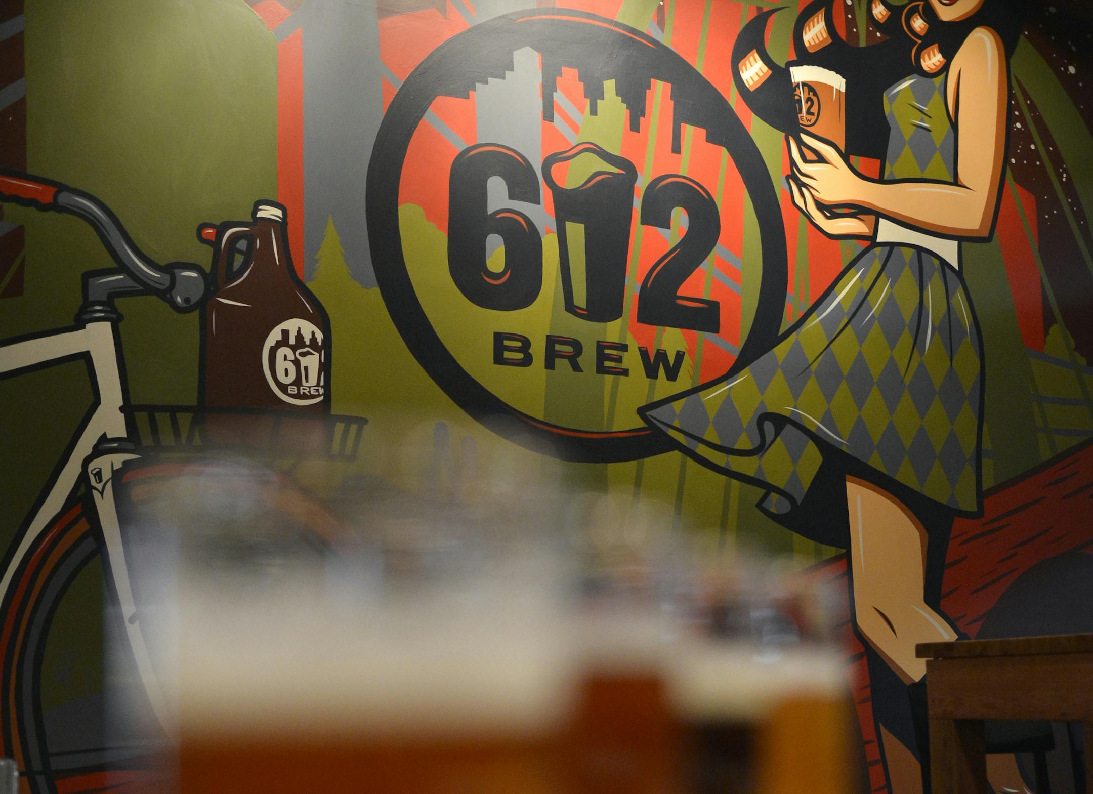 A highlight of the 612Brew taproom is local artist, Adam Turman's mural. ] (SPECIAL TO THE STAR TRIBUNE/BRE McGEE) **Adam Turman (local artist, muralist) ORG XMIT: MIN1302111116530936