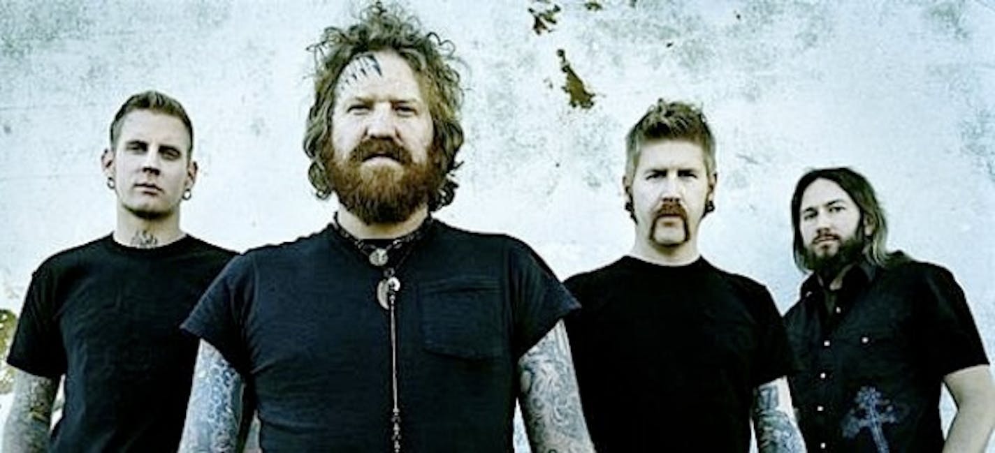 Mastodon's Brent Hinds, second from left, might have a similar-looking forehead to Opeth's Mikael Akerfeldt after last night.