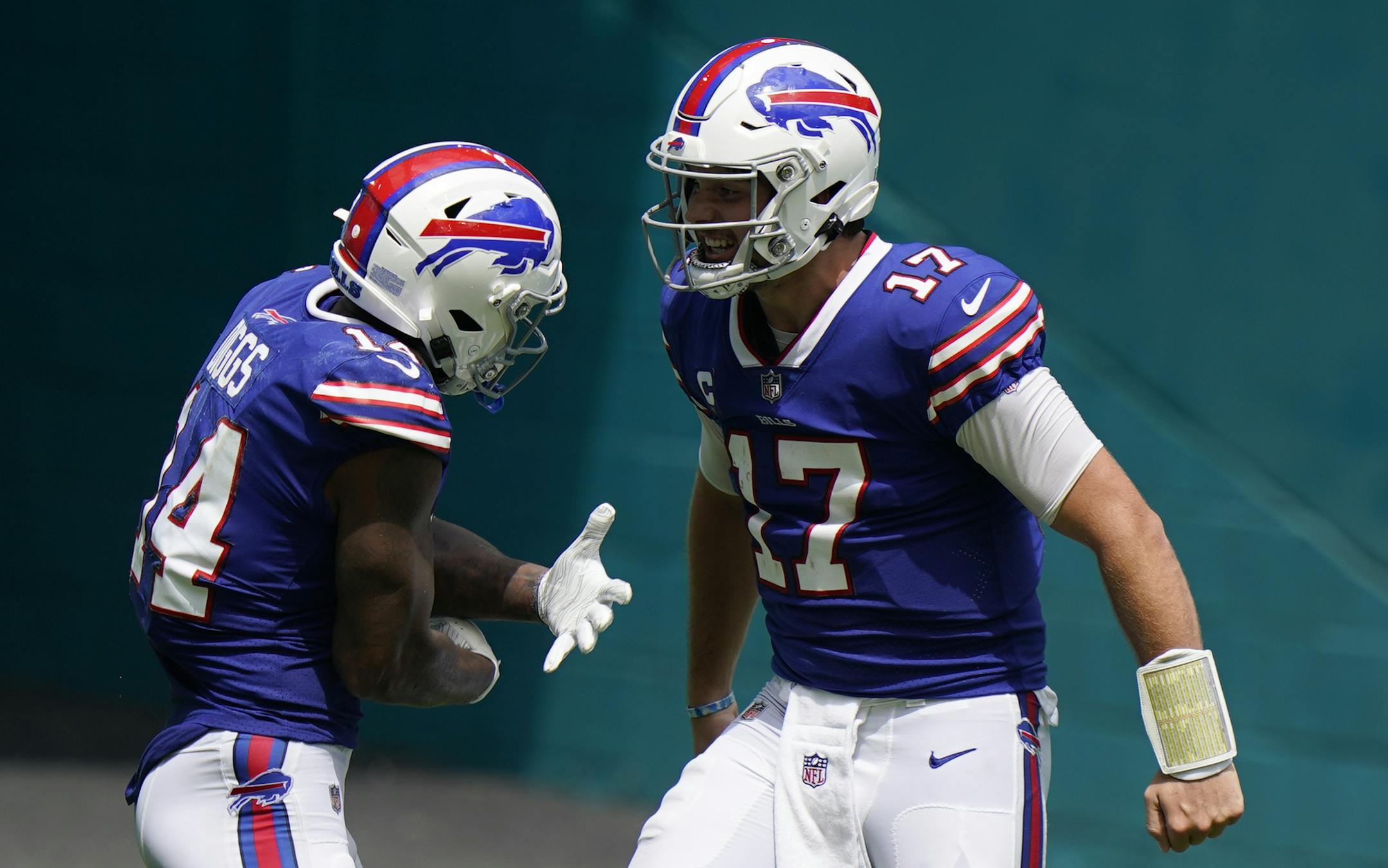 Buffalo Bills quarterback Josh Allen (17) celebrates with wide receiver Stefon Diggs (14) after Diggs scored a touchdown during the first half of an NFL football game against the Miami Dolphins, Sunday, Sept. 20, 2020 in Miami Gardens, Fla. (AP Photo/Wilfredo Lee)