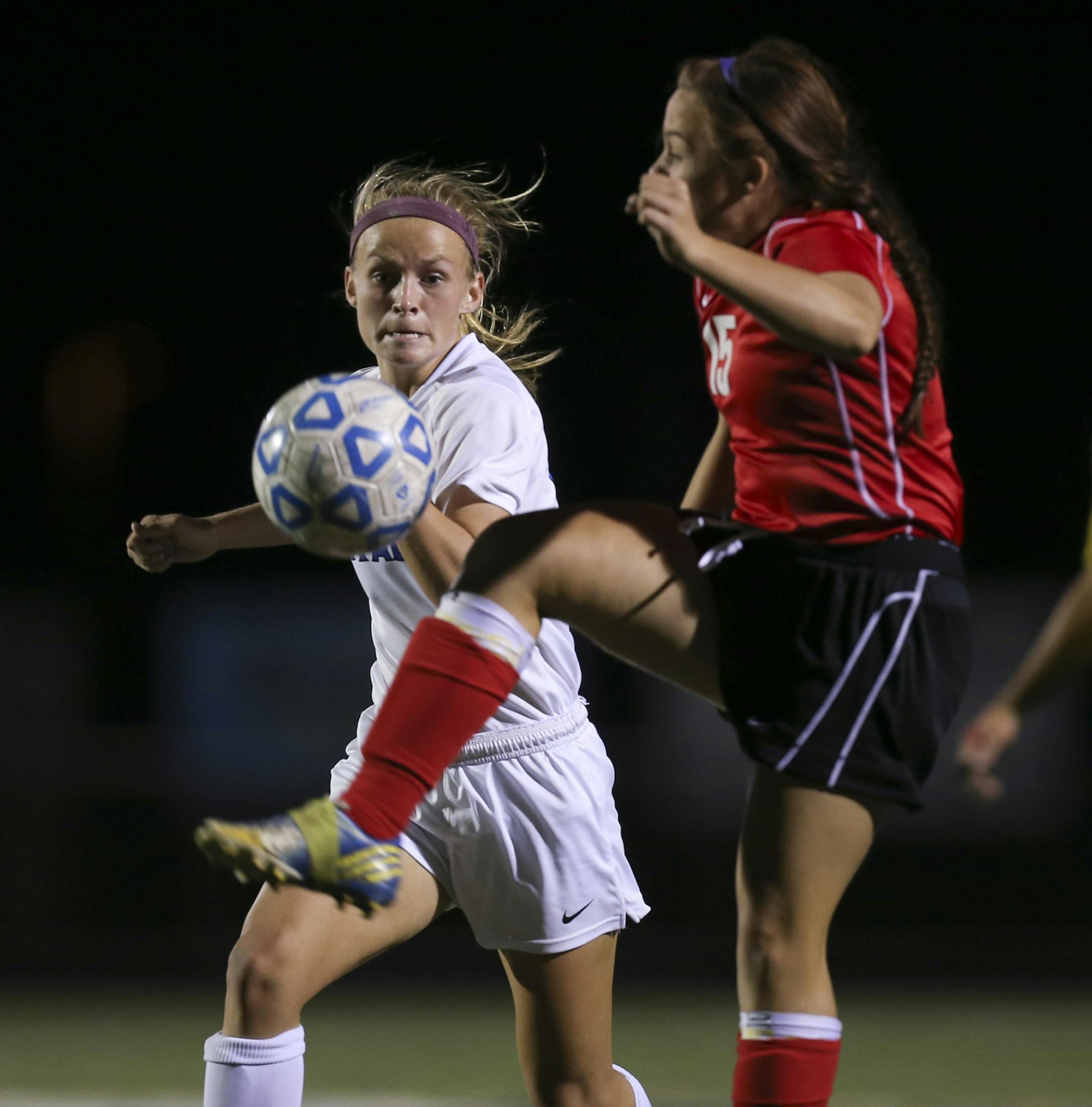 The Woodbury girl's soccer team beat North St. Paul 5-0 in a first round sectional tournament game at Woodbury High School Tuesday night, October 8, 2013. Woodbury's Madison Gaffney and North St. Paul's Callie Nelson converged on the ball in the first half.] JEFF WHEELER &#x201a;&#xc4;&#xa2; jeff.wheeler@startribune.com
