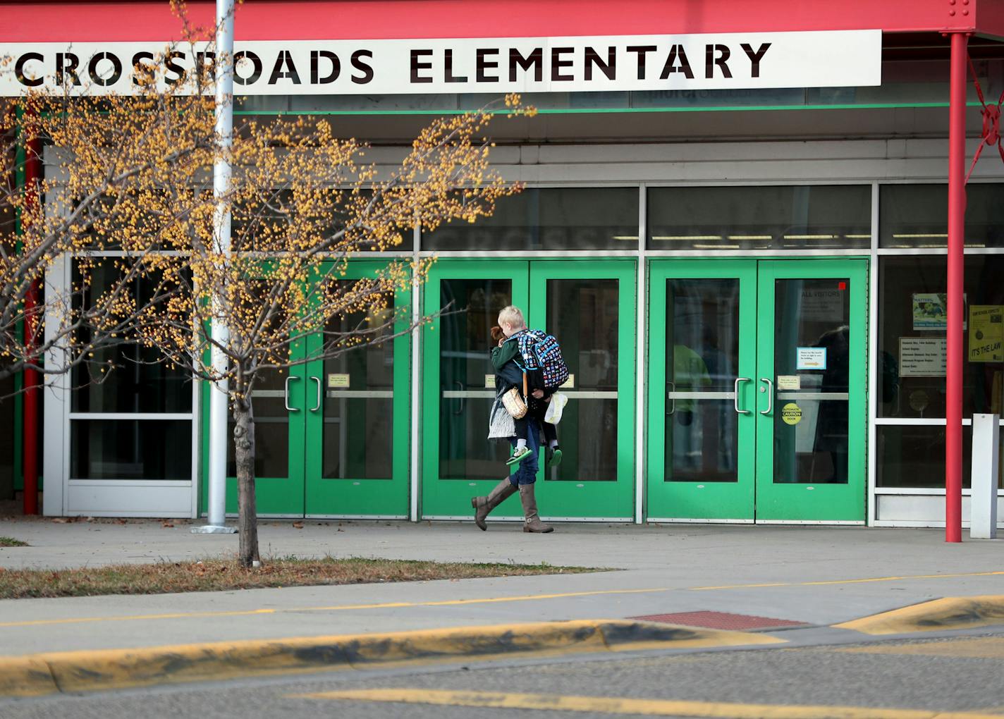 A loaded handgun brought to Crossroads Elementary School by a seven-year-old first grade student discharged one round but no one was hurt Thursday, Nov. 17, 2016, in St. Paul, MN. Here, parents pick up their children from the school Thursday afternoon.] (DAVID JOLES/STARTRIBUNE)djoles@startribune.com A loaded handgun brought to Crossroads Elementary School by a seven-year-old first grade student discharged one round but no one was hurt Thursday, Nov. 17, 2016, in St. Paul, MN.