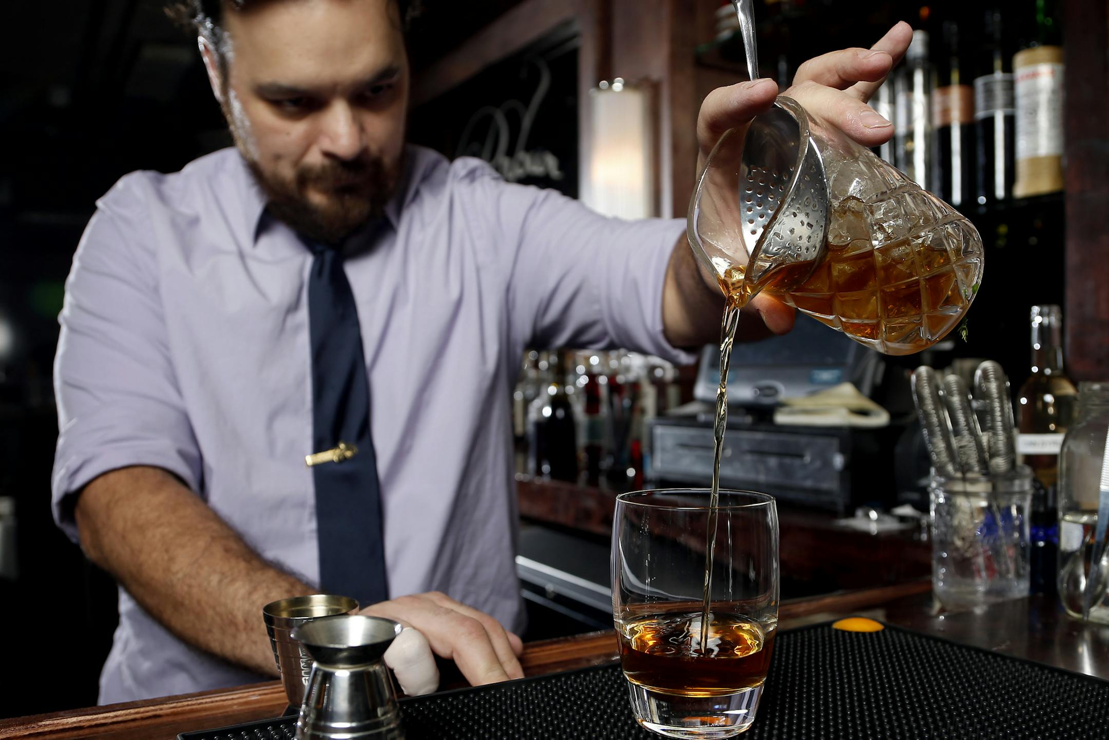 Bartender Jesse Held made his version of Manhattan at Parlour/Burough in Minneapolis. ] CARLOS GONZALEZ cgonzalez@startribune.com - February 25, 2013, Minneapolis, Minn., Parlour/Burough Twin Cities bartenders are putting their own twists on this iconic drink. From classic to experimental, barrel-aged batches to brandy-based renditions, we explore the many flavors of local Manhattans.
