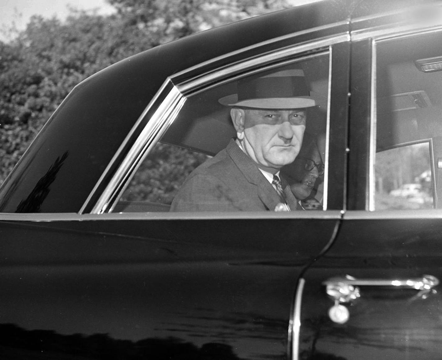 President Lyndon Johnson leaves his home in Washington, D.C., November 25,1963 for a five-mile ride downtown to his offices near the White House.