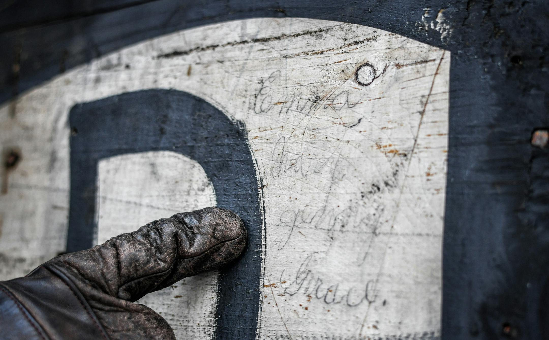 Emma, Mary, Genny, Grace, names written in pencil on the boards from an 1870's era skating rink found on an old home in St. Paul. ] GLEN STUBBE &#xa5; glen.stubbe@startribune.com Wednesday, December 6, 2017 Beneath the asbestos shingles, and beneath a layer of cedar shakes behind that, Todd Johnson found something unexpected covering his 1881 house: Old hand-painted signs. It seems that boards that were painted signs on even older buildings were recycled when Johnson's Holly Avenue house was bui