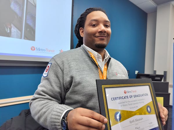Keith Alexander, of Minneapolis, was one of 22 bus drivers who received diplomas from Metro Transit on Tuesday.