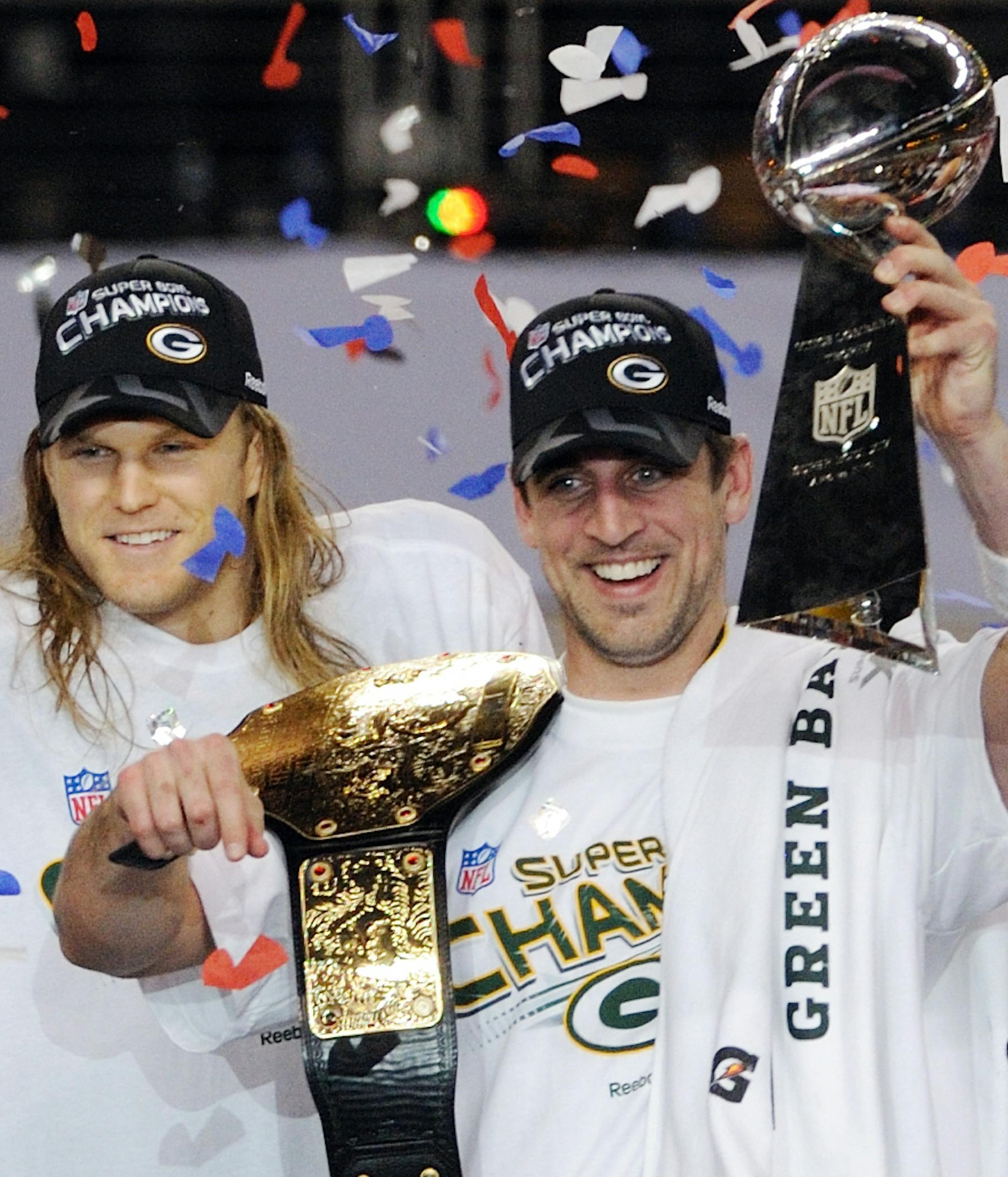 Green Bay Packers linebacker Clay Matthews and quarterback Aaron Rodgers holding the Vince Lombardi Trophy and championship belt after defeating the Pittsburgh Steelers 31-25 in Super Bowl XLV at Cowboys Stadium, February 6, 2011 in Arlington, Texas. (AP Photo/David Drapkin) ORG XMIT: SB1 259