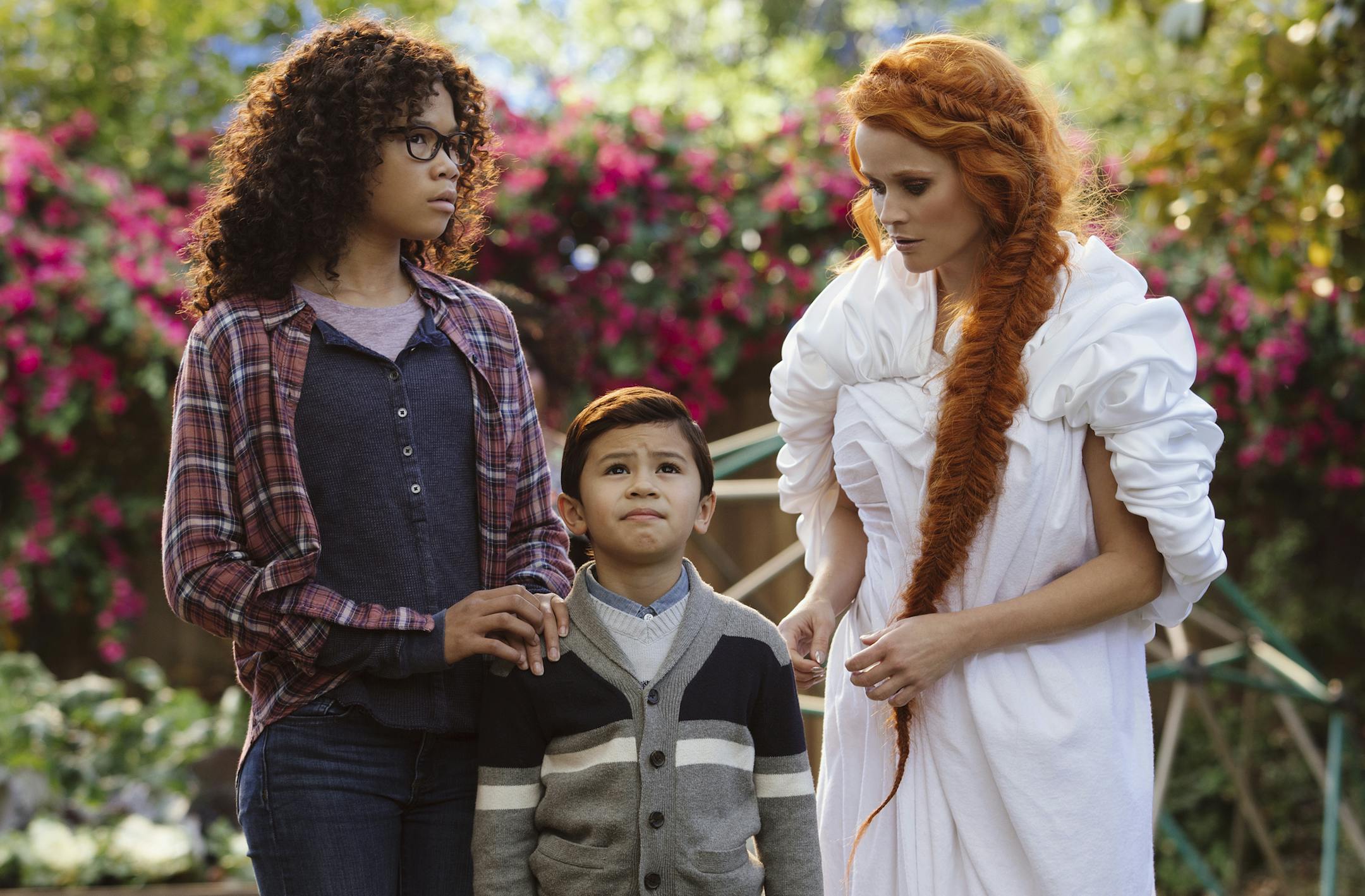 This image released by Disney shows Storm Reid, from left, Deric McCabe and Reese Witherspoon in a scene from "A Wrinkle In Time." (Atsushi Nishijima/Disney via AP)