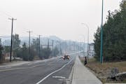 Wildfire smoke fills the air over Yellowknife, Canada, on Thursday. Smoke from fires in the Northwest Territories is polluting the air south of the bo