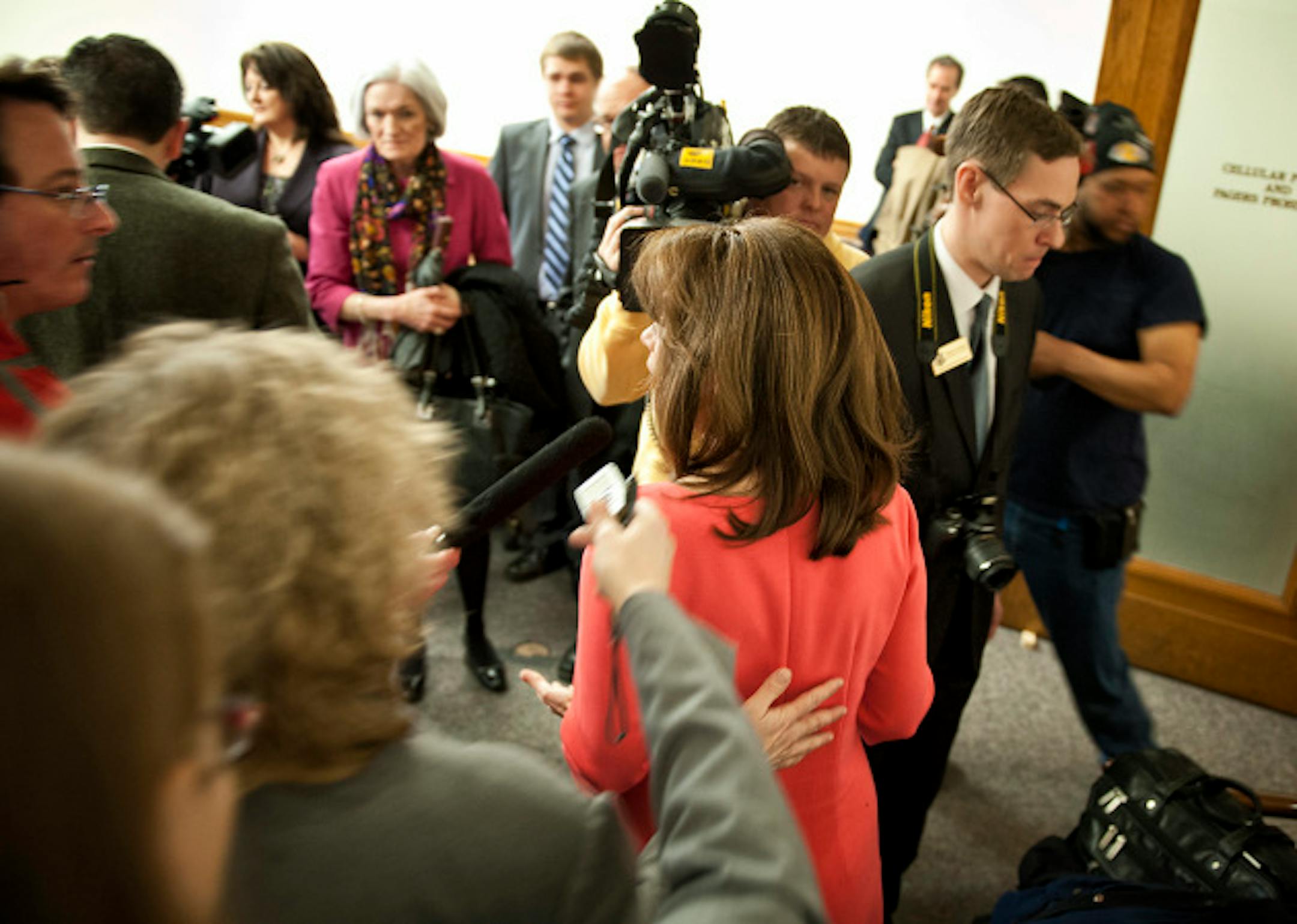 Aide Deb Steiskal blocked Star Tribune reporter Rachel Stassen-Berger, left and aide Brian Gordon blocked cameramen John Cottew from Fox 9 and Art Phillips from WCCO.  Congresswoman Michele Bachmann and State Senator Sean Nienow (R-Cambridge) held a joint news conference to discuss problems with Medicaid reimbursement rates paid to doctors in Minnesota.  Both are introducing legislation increasing accountability and transparency.  When the questioning turned to Rep. Bachmann's ethics problems from her 2012 presidential campaign, aides closed in blocking reporters and photographers and ushered her out of the room.    Tuesday, April 9, 2013  ]   GLEN STUBBE * gstubbe@startribune.com