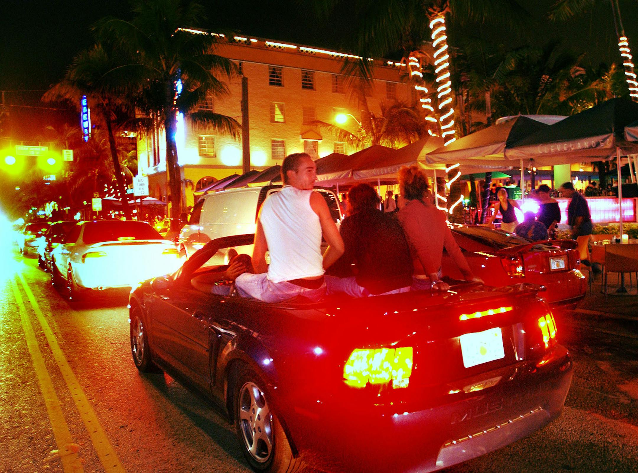 Cars cruise Ocean Drive in Miami during spring break in a 2003 file image. (Roberto Gonzalez/Orlando Sentinel/TNS)