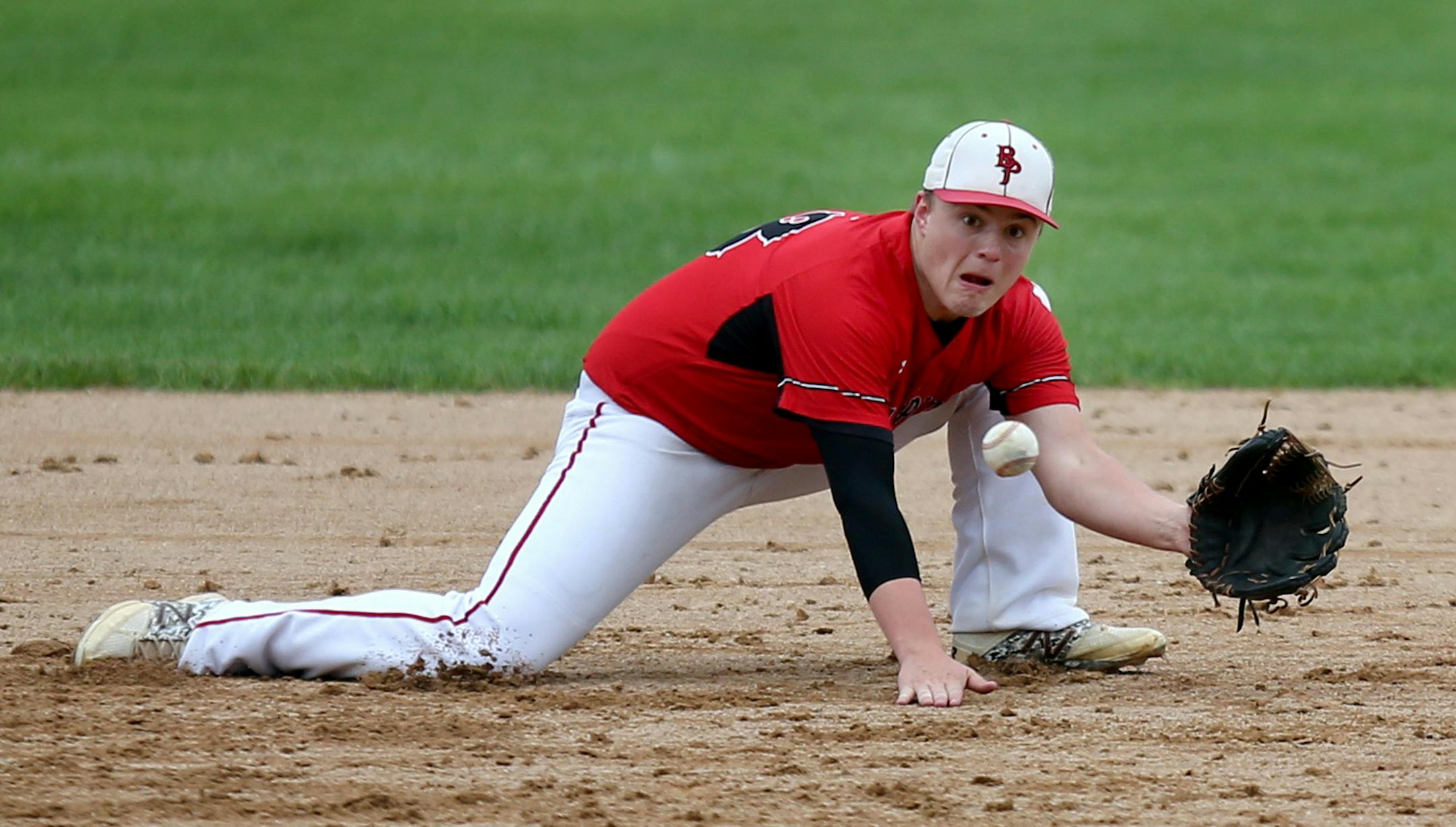 Belle Plaine’s Ben Wagner snagged a grounder during a game against Sibley East. The Tigers won the Minnesota River Conference with an 11-3 record. (Kyndell Harkness, Star Tribune)