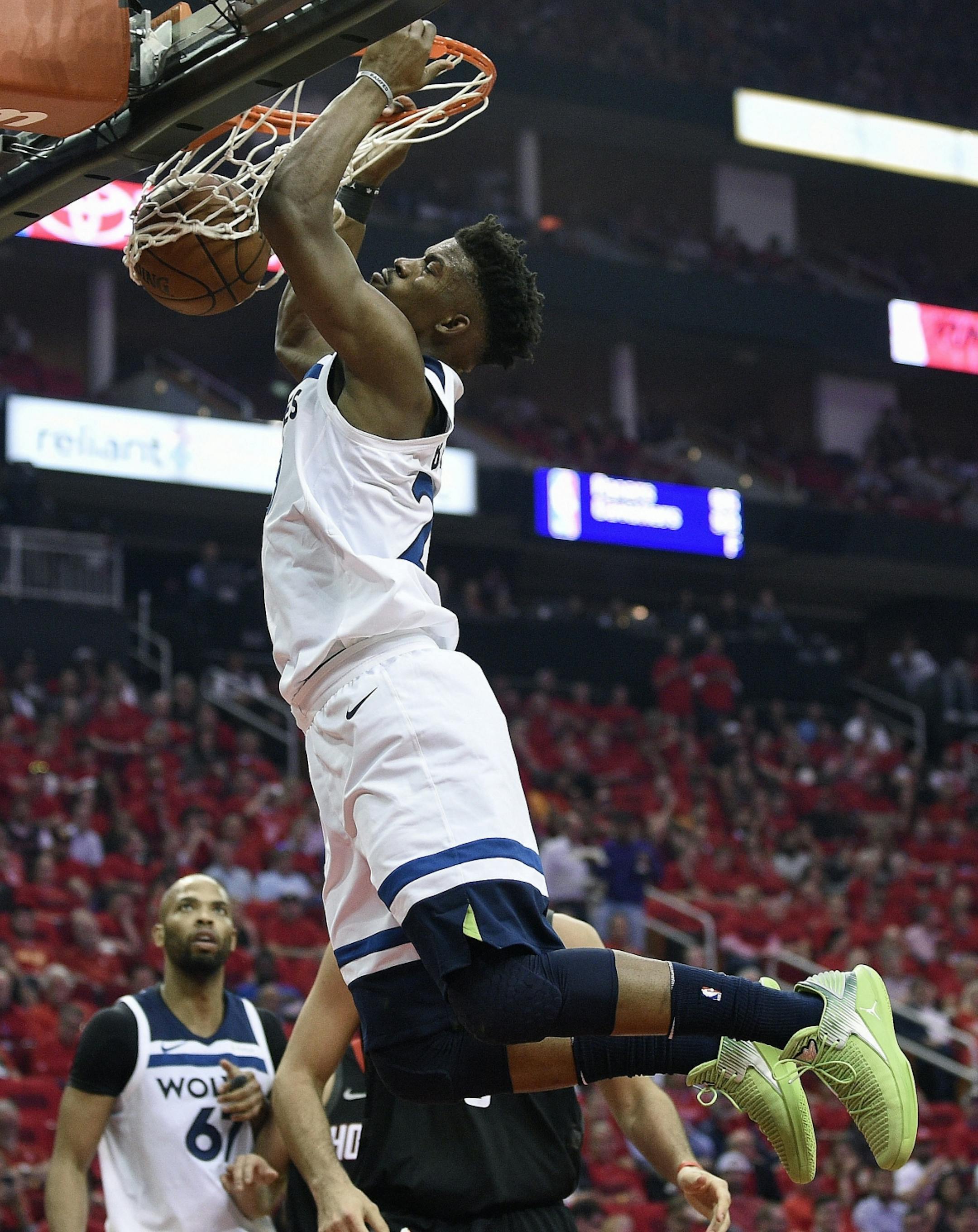 Minnesota Timberwolves guard Jimmy Butler dunks during the first half in Game 5 of a first-round NBA basketball playoff series, Wednesday, April 25, 2018, in Houston.