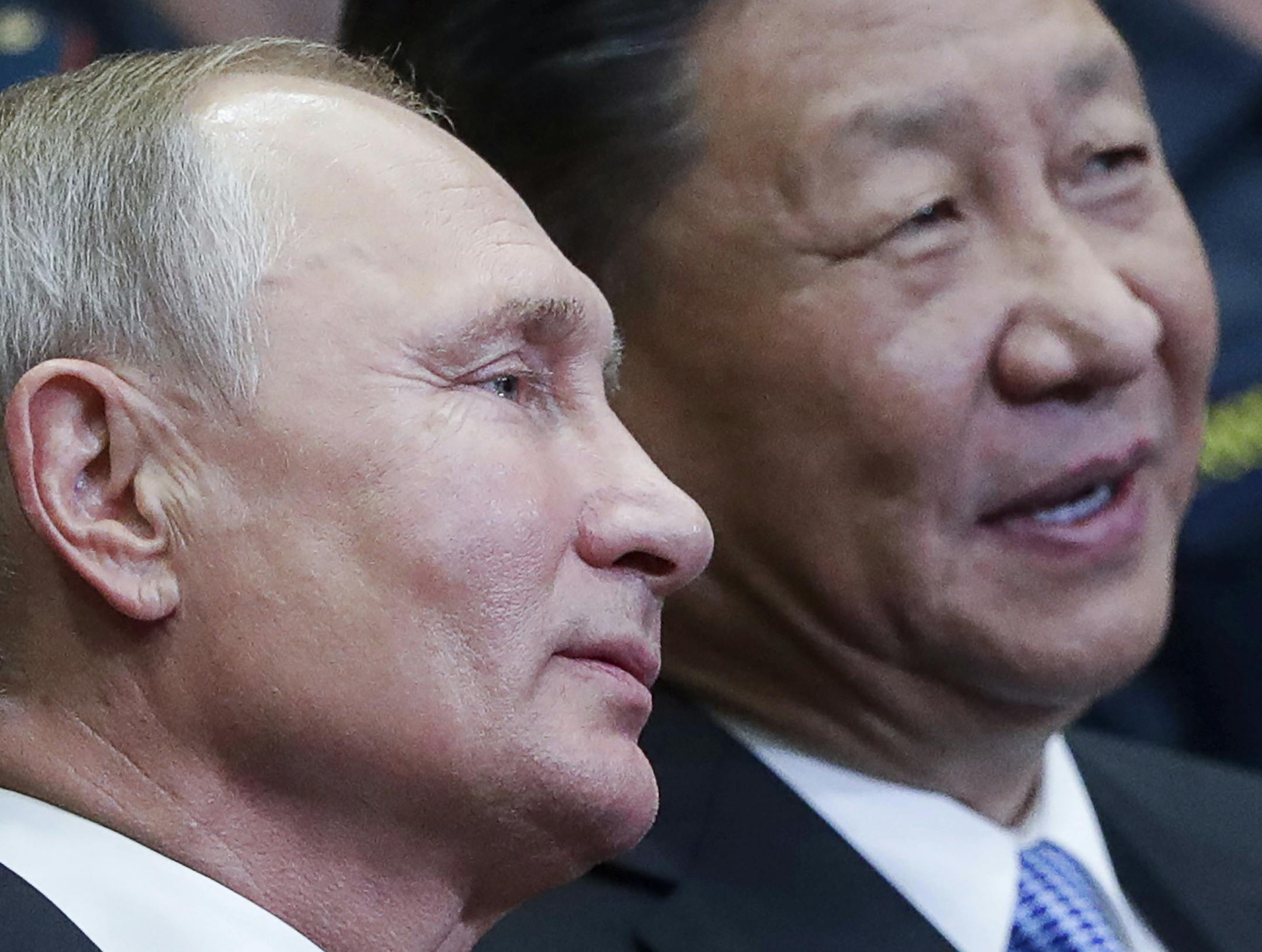 CORRECTING SLUG TO RUSSIA CHINA - Russian President Vladimir Putin, left, and Chinese President Xi Jinping visit the Ocean Russian children recreation center after at the Eastern Economic Forum in Vladivostok, Russia, Wednesday, Sept. 12, 2018. (Mikhail Metzel/TASS News Agency Pool Photo via AP)