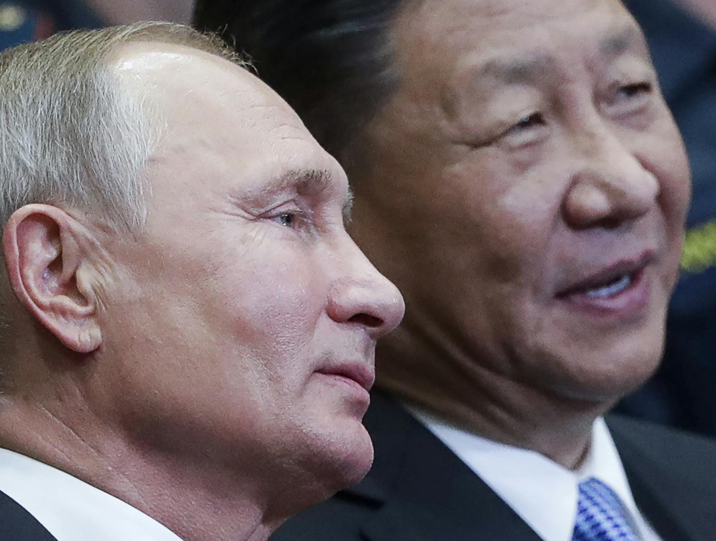 CORRECTING SLUG TO RUSSIA CHINA - Russian President Vladimir Putin, left, and Chinese President Xi Jinping visit the Ocean Russian children recreation center after at the Eastern Economic Forum in Vladivostok, Russia, Wednesday, Sept. 12, 2018. (Mikhail Metzel/TASS News Agency Pool Photo via AP)