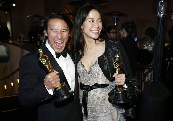 Jimmy Chin, left, and Elizabeth Chai Vasarhelyi, winners of the award for best documentary feature for "Free Solo", attend the Governors Ball after th