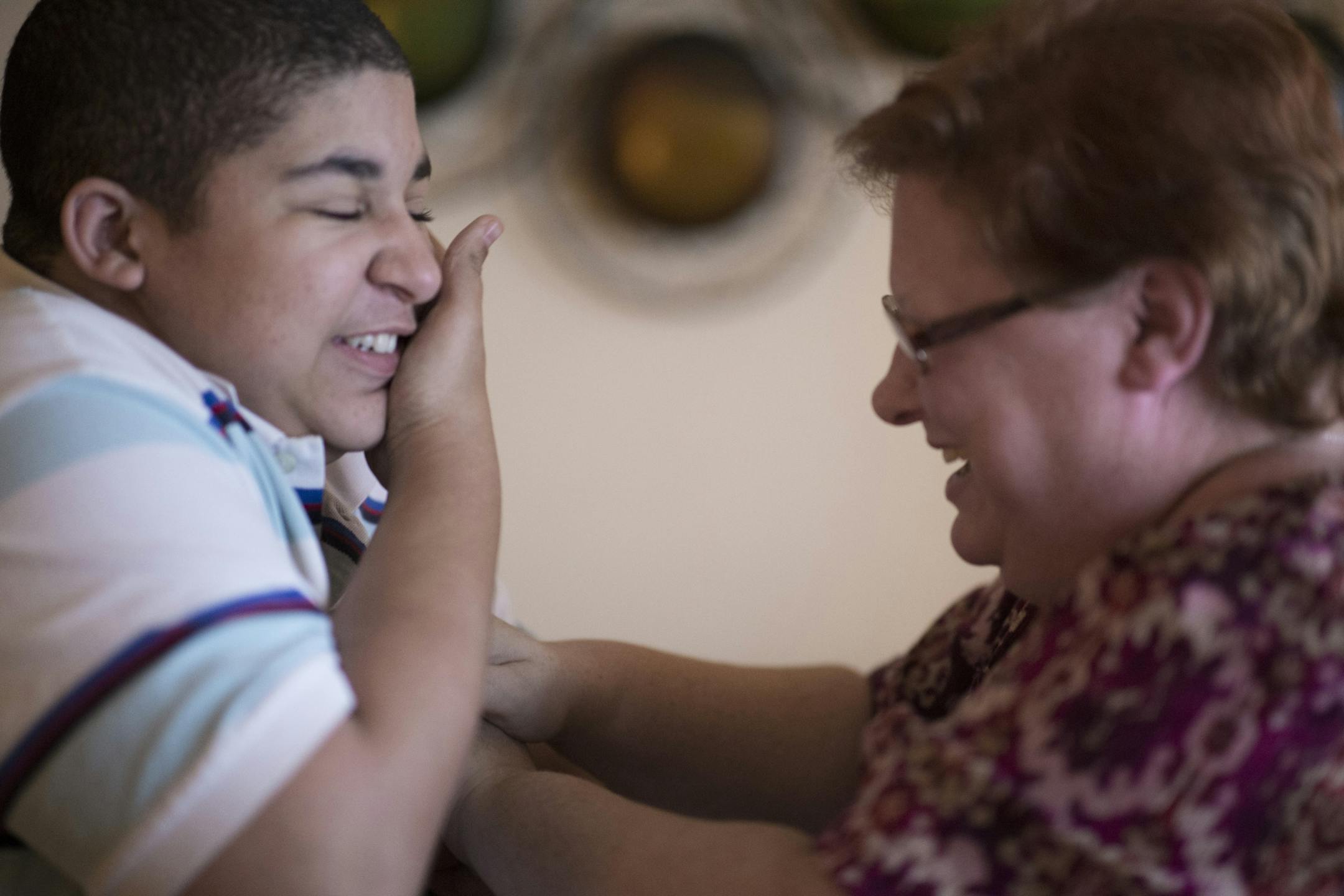 Cora Mustin tickled her 15-year-old son Jordan Mustin in their apartment after he arrived home from school Thursday December 14, 2017 in Mounds View, MN. Jordan has autism and a history of violent outbursts toward himself and family.