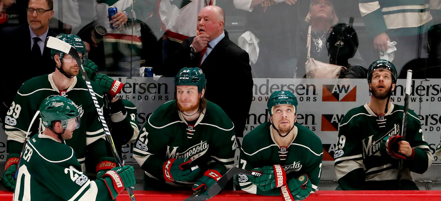 Coach Bruce Boudreau and the Wild bench after a series-clinching 4-3 overtime loss to the St. Louis Blues in Game 5 of the Western Conference quarterfinals on Saturday at Xcel Energy Center.