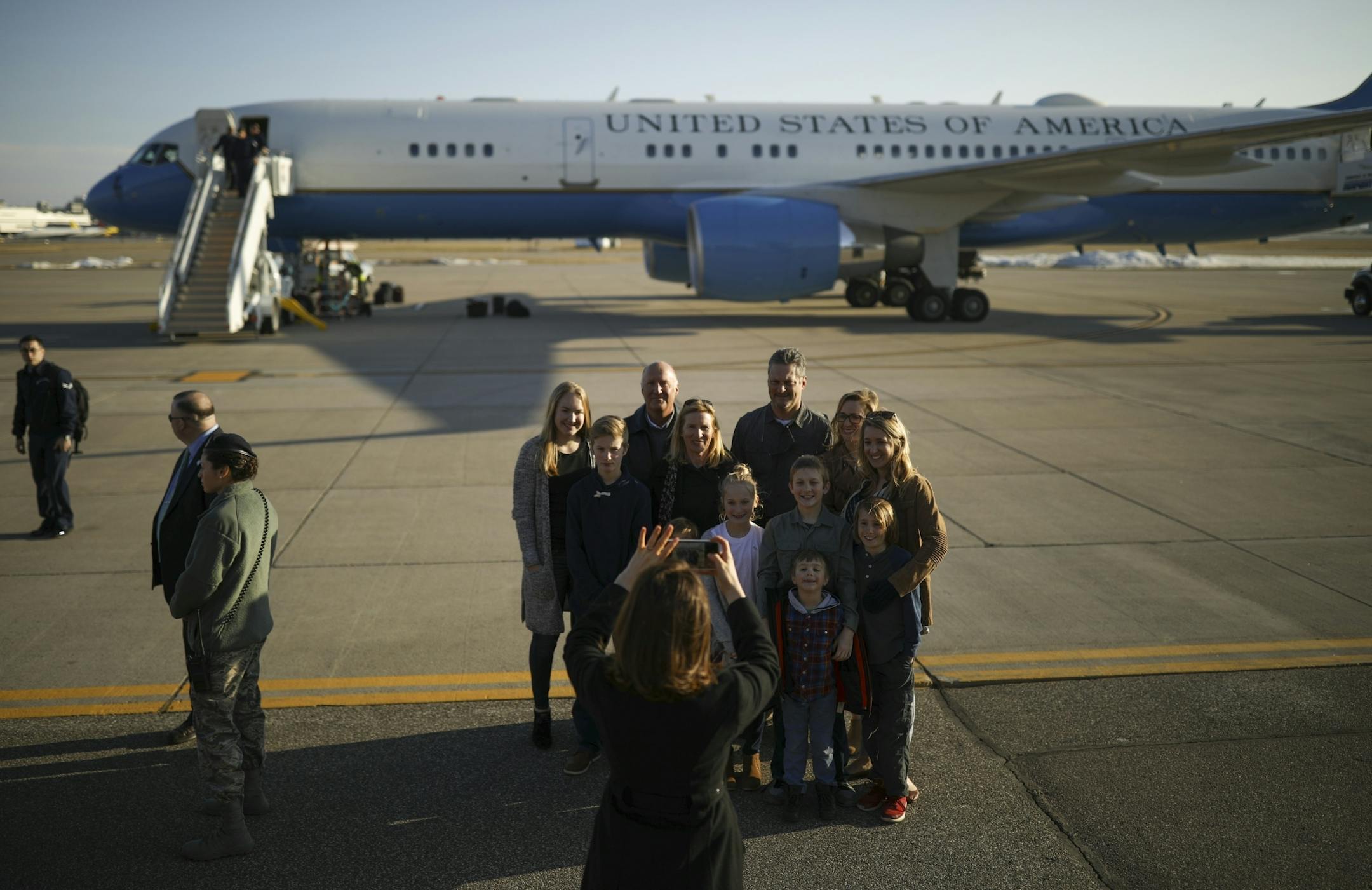 Guests posed for a photo with Air Force Two as a backdrop after Vice President Mike Pence departed from the Minnesota National Guard - 934th Airlift Wing. Guests were given the opportunity to tour Air Force Two after the Vice President left the airport.