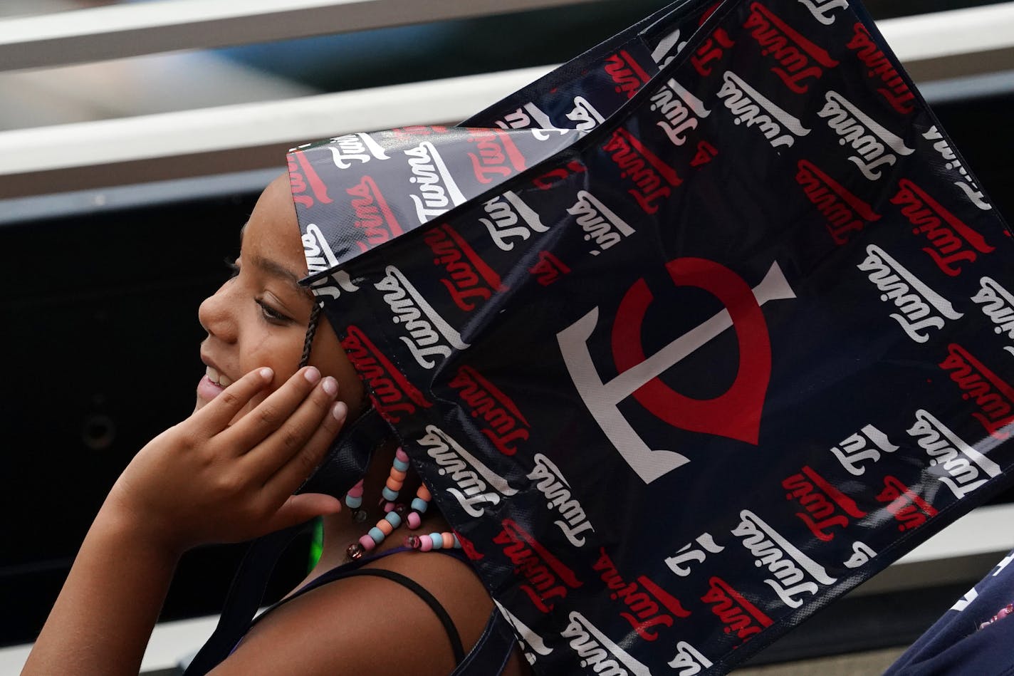 A young Twins fan wore a bag over her head as the rain drops started to fall Saturday afternoon at Target field before the game against the Cleveland Indians was postponed due to the impending rain storms Saturday. ] ANTHONY SOUFFLE • anthony.souffle@startribune.com