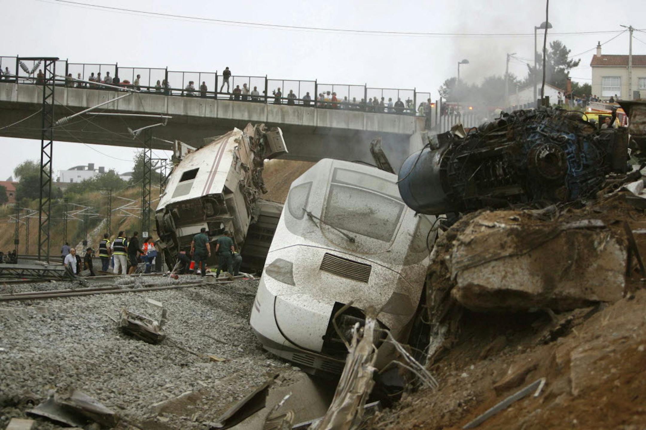 Emergency personnel respond to the scene of a train derailment in Santiago de Compostela, Spain, on Wednesday.