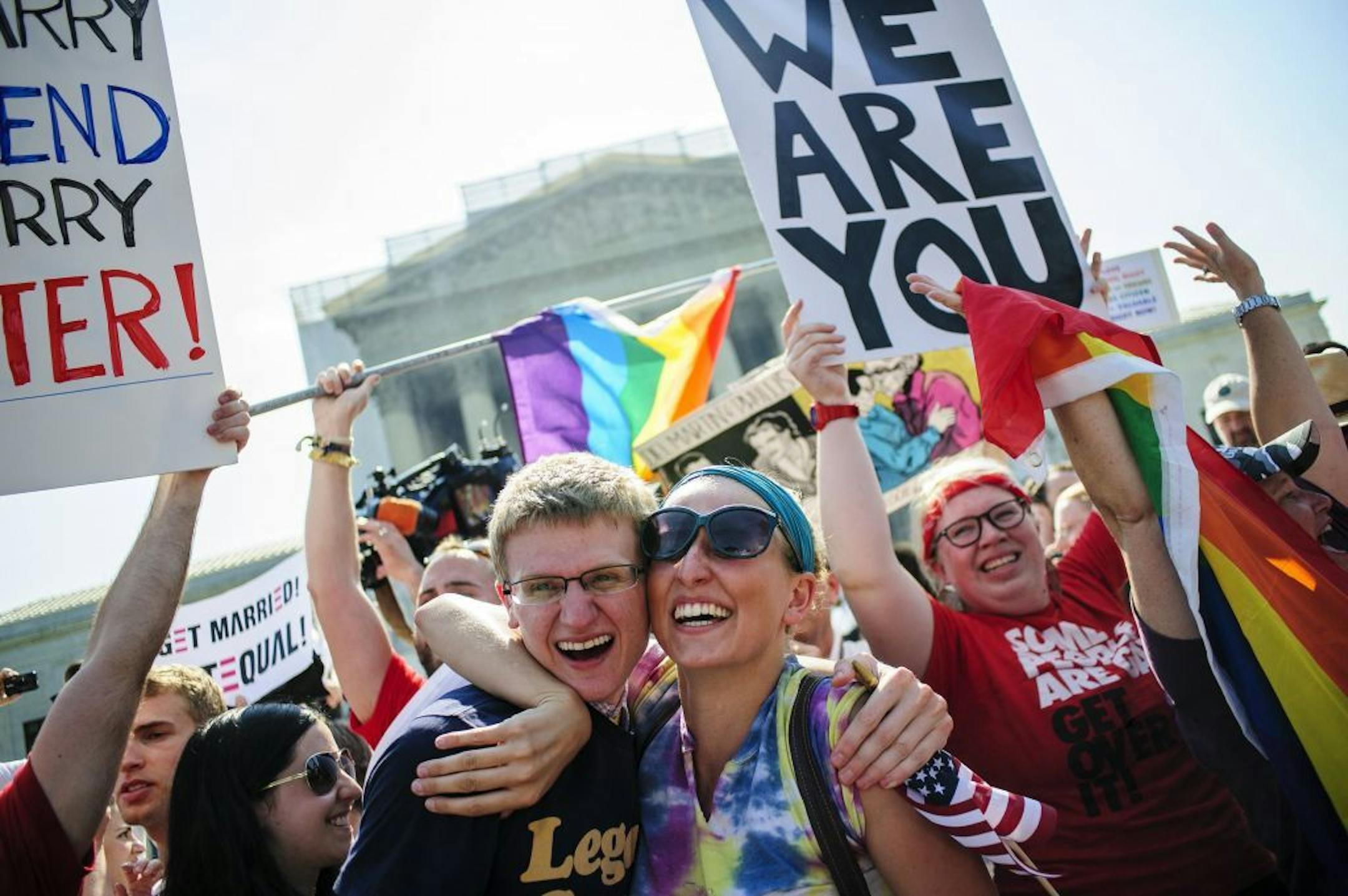 Supporters of same sex marriage celebrate outside the Supreme Court after hearing that the Court struck down the Defense of Marriage Act, Wednesday, June 26, 2013, in Washington, D.C.