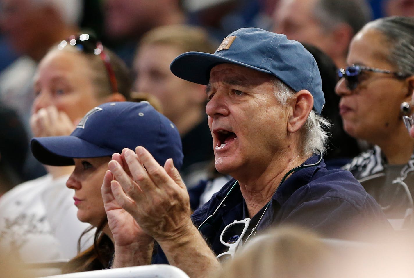 Actor and comedian Bill Murray cheers as he watches the first half of the first round of the NCAA college basketball tournament between Maryland and Xavier, Thursday, March 16, 2017 in Orlando, Fla. (AP Photo/Wilfredo Lee)