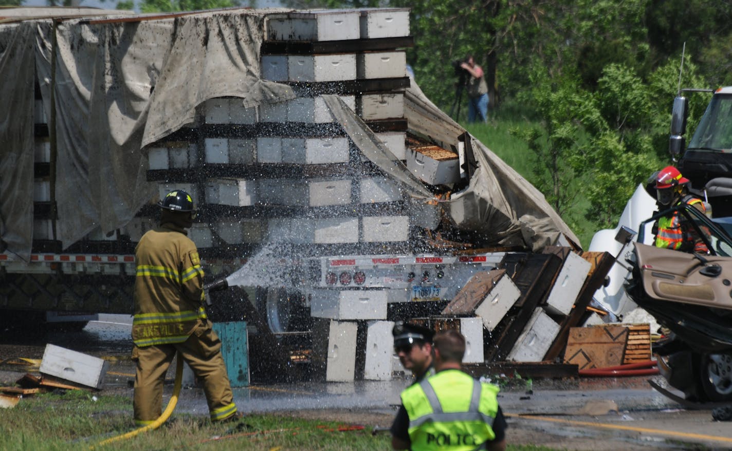 A multivehicle crash on I-35 in Lakeville late Monday morning killed people. First responders battle bees that escaped from a semi.