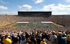The national anthem is played at Michigan Stadium before a NCAA college football game between Michigan and Army in Ann Arbor, Mich., Saturday, Sept. 7