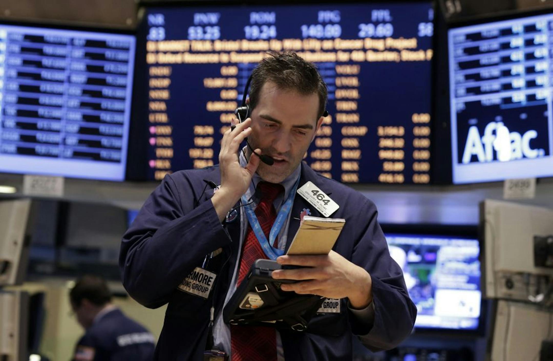 Trader Gregory Rowe works on the floor of the New York Stock Exchange Tuesday, Jan. 29, 2013. Stocks opened mixed on Wall Street, with the Standard & Poor's 500 holding at 1,500.