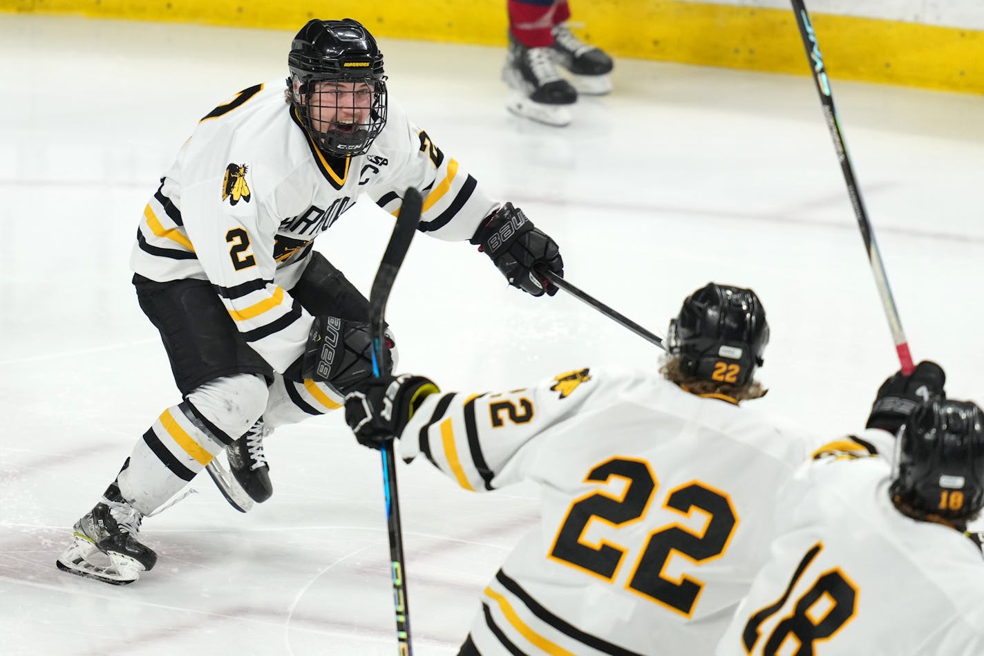 Warroad defenseman Erick Comstock (2) celebrates after scoring the game winning goal past Orono goaltender Brock Peyton (1) in the second period of overtime of a MSHSL Class 1A state semifinal hockey game between Warroad and Orono Friday, March 10, 2023 at the Xcel Energy Center in St. Paul, Minn. ] ANTHONY SOUFFLE • anthony.souffle@startribune.com