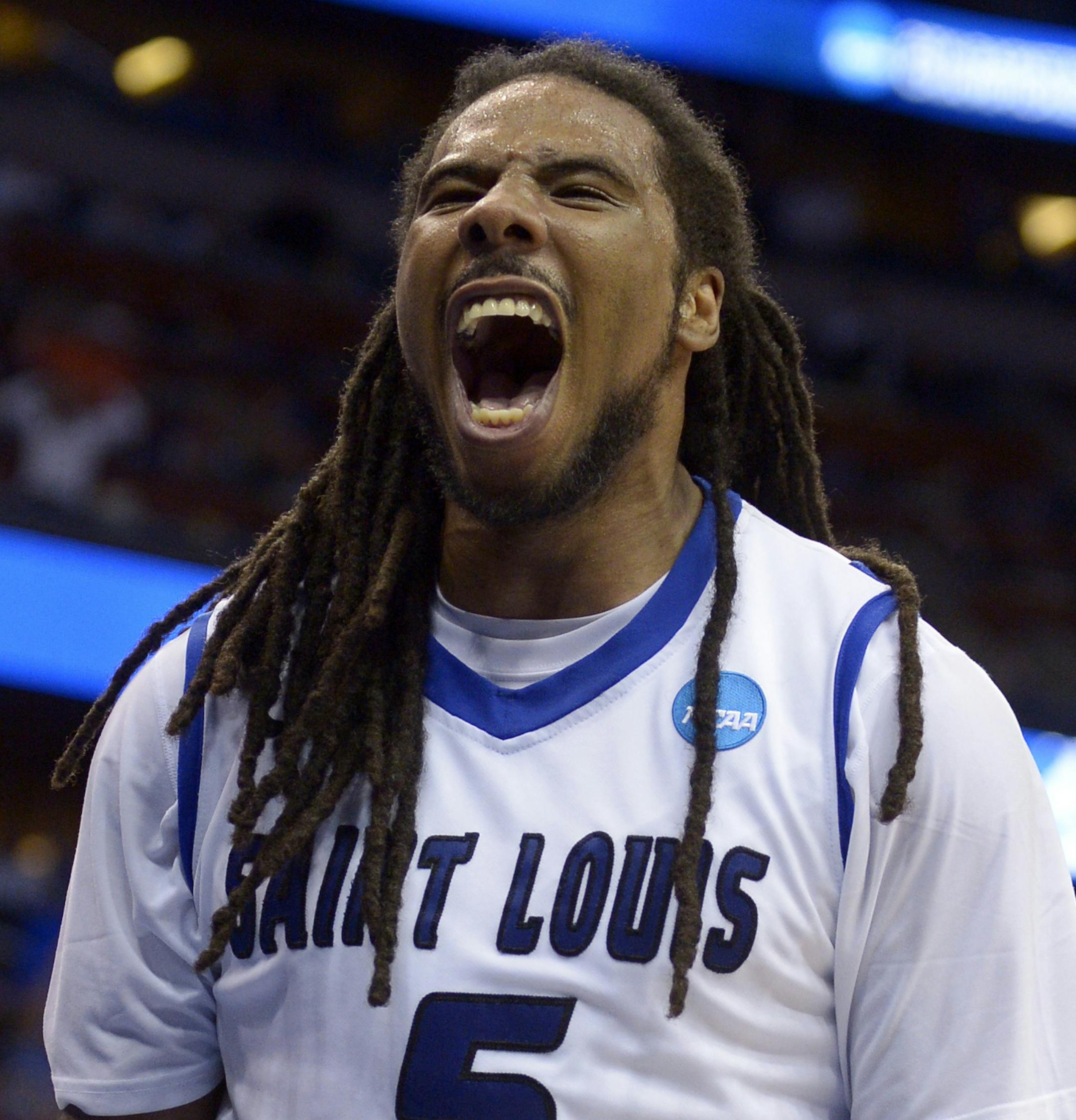 Saint Louis guard Jordair Jett (5) screams as his team ties the game with North Carolina State in the second half of a second-round game in the NCAA college basketball tournament Thursday, March 20, 2014, in Orlando, Fla. (AP Photo/Phelan M. Ebenhack)