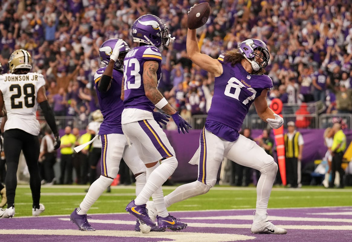 Minnesota Vikings tight end T.J. Hockenson (87) celebrates after scoring a touchdown late in the second quarter of an NFL game between the Minnesota V
