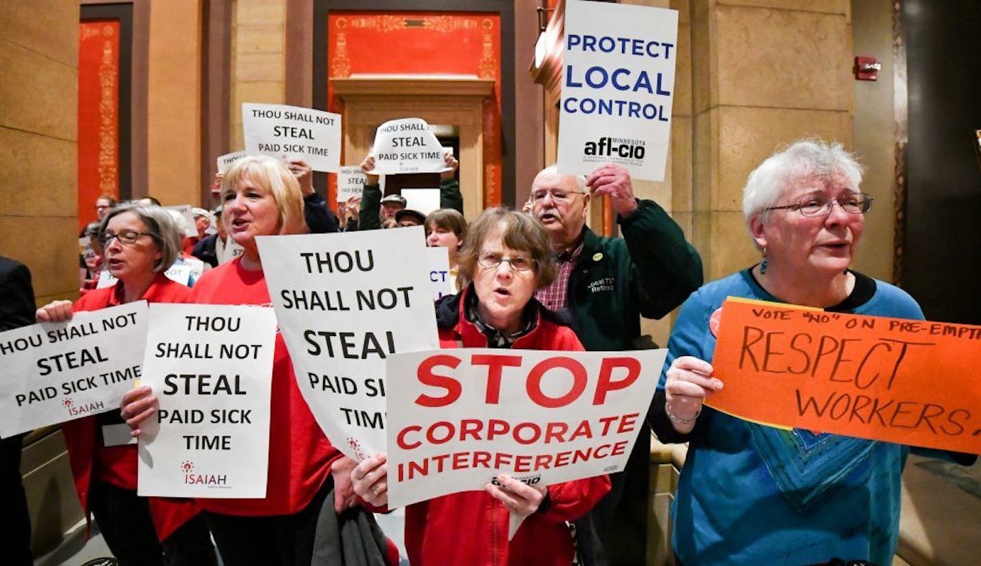 A coalition of groups including Main Street Alliance, TakeAction Minnesota, Neighborhoods Organizing for Change (NOC), SEIU Minnesota, AFL-CIO, and Isaiah protested the preemption bill outside the Senate Chamber in 2017.