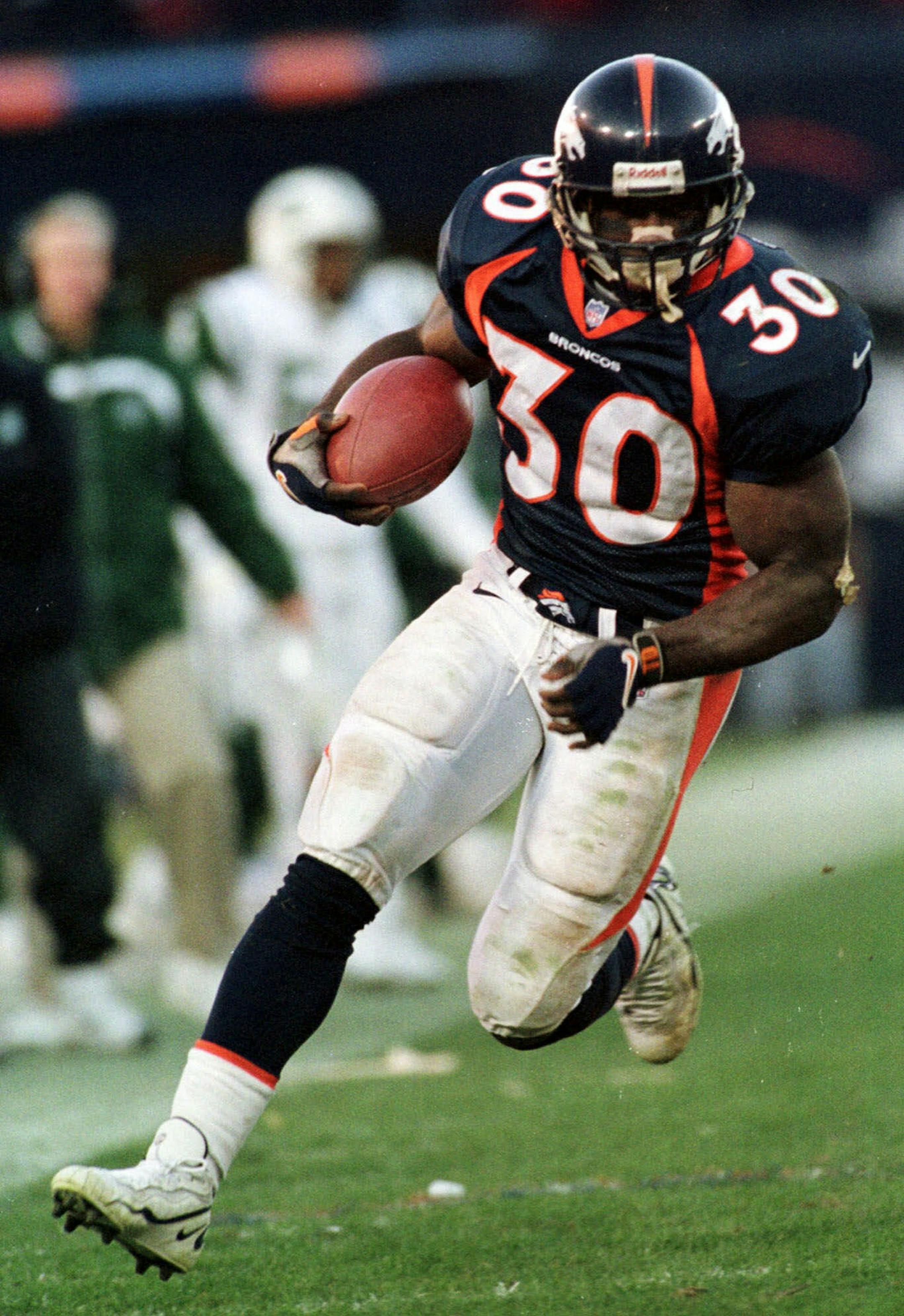 Denver Broncos running back Terrell Davis carries the ball against the New York Jets during the second half of the AFC Championship Sunday, Jan. 17, 1999 at Mile High Stadium in Denver. Davis rushed for 167 yards and one touchdown in the Broncos 23-10 win. The Broncos will play the Atlanta Falcons in Super Bowl XXXIII on Sunday, Jan. 31, in Miami.(AP Photo/Jack Dempsey) ORG XMIT: DXS201