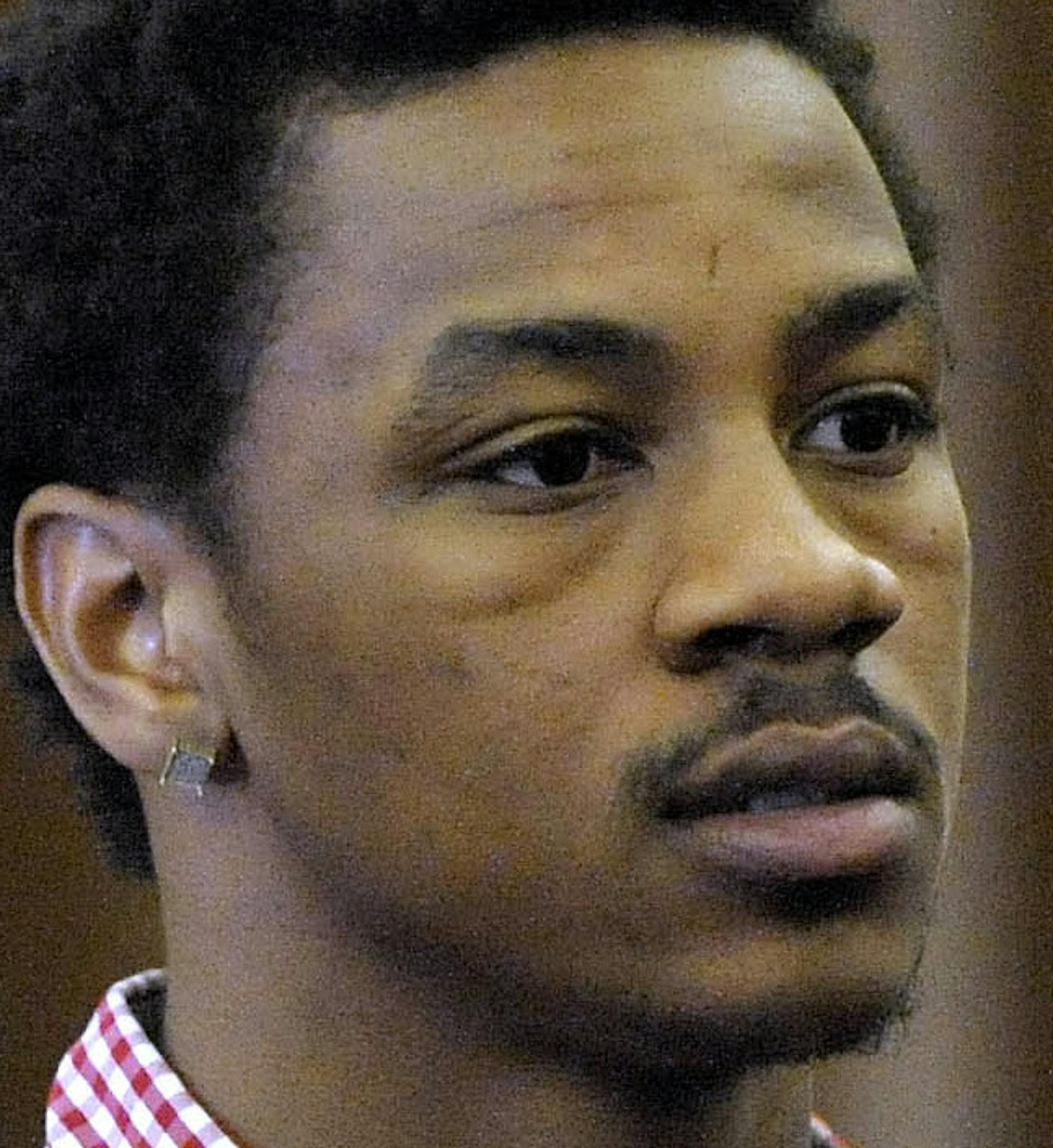 Former Michigan State basketball player and current NBA player Keith Appling, center, is joined with his attorneys, Cyril Hall, left, and Amir Makled as he is arraigned in Dearborn, Mich., Wednesday, May 4, 2016. Appling was charged Wednesday with carrying a concealed weapon and other crimes after being found in possession of guns and marijuana in suburban Detroit, according to authorities. (Todd McInturf/Detroit News via AP) MANDATORY CREDIT ORG XMIT: MIN2016061817404634
