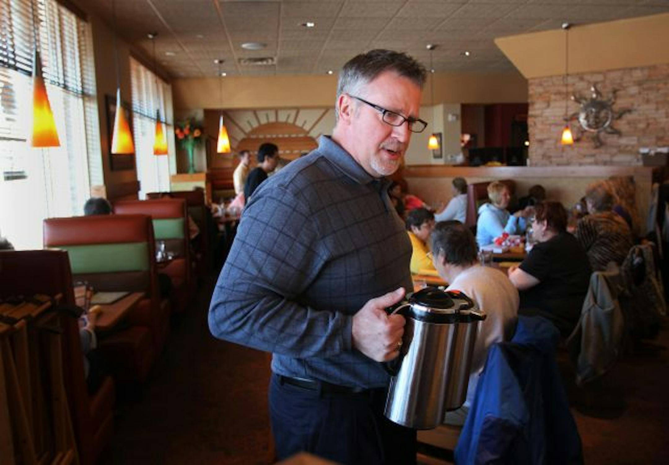Doron Jensen talked with his customers at Jensen's Cafe Thursday at lunchtime.