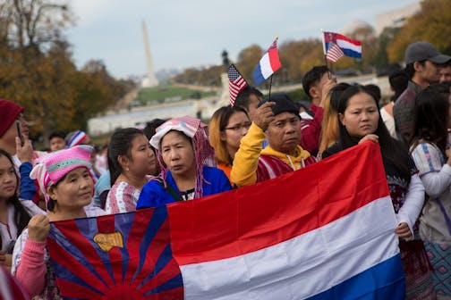 Minnesotans, left to right, Thadah Paw, Hare Wal, Zarni (no last name), and Aye Martha, all of St. Paul, hold a Karen flag as members of the Karen ethnic group rally to bring attention to the human rights violations towards religious and ethnic minorities in the Burma region, in front of the U.S. Capitol building on Capitol Hill in Washington, D.C., November 6, 2017. As resettlement of Karen refugees to the United States winds down, advocacy efforts have increased in support of more than 120,000