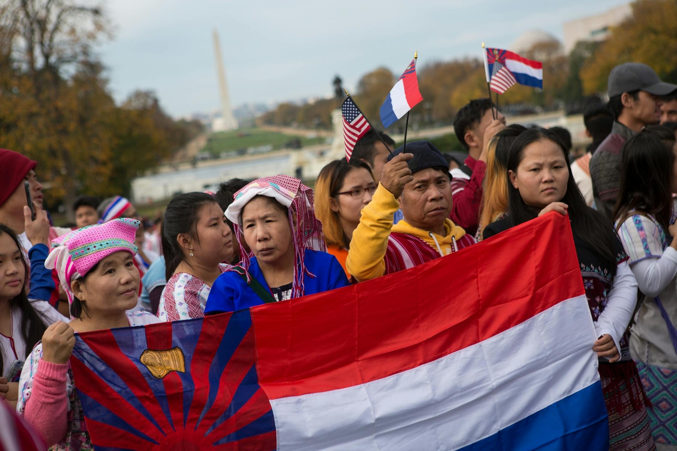 Minnesotans, left to right, Thadah Paw, Hare Wal, Zarni (no last name), and Aye Martha, all of St. Paul, hold a Karen flag as members of the Karen ethnic group rally to bring attention to the human rights violations towards religious and ethnic minorities in the Burma region, in front of the U.S. Capitol building on Capitol Hill in Washington, D.C., November 6, 2017. As resettlement of Karen refugees to the United States winds down, advocacy efforts have increased in support of more than 120,000