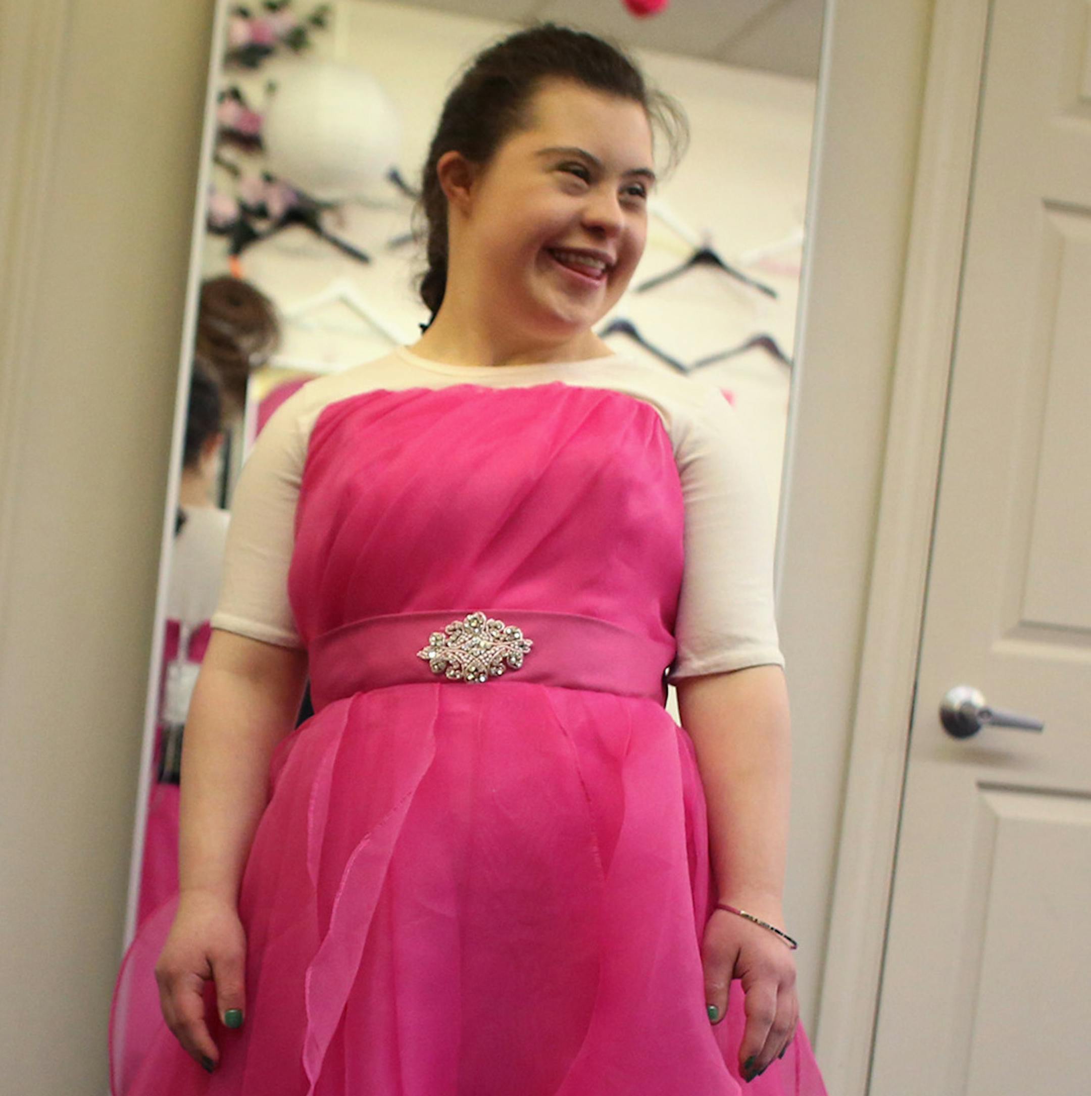 Olivia Elder, 19, showed off her first dress that she tried on that day as she tried to decide which one for the pageant. ] (KYNDELL HARKNESS/STAR TRIBUNE) kyndell.harkness@startribune.com Nina is taking younger sister Olivia shopping for the evening gown that she will wear during the Minnesota Miss Amazing Pageant at Bride to be Consignment in Bloomington Min., Tuesday, April 7, 2014.