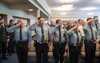 Saying the Pledge of Allegiance are some of the twelve new Minneapolis Police Department Sergeants. ] GLEN STUBBE &#x2022; glen.stubbe@startribune.com