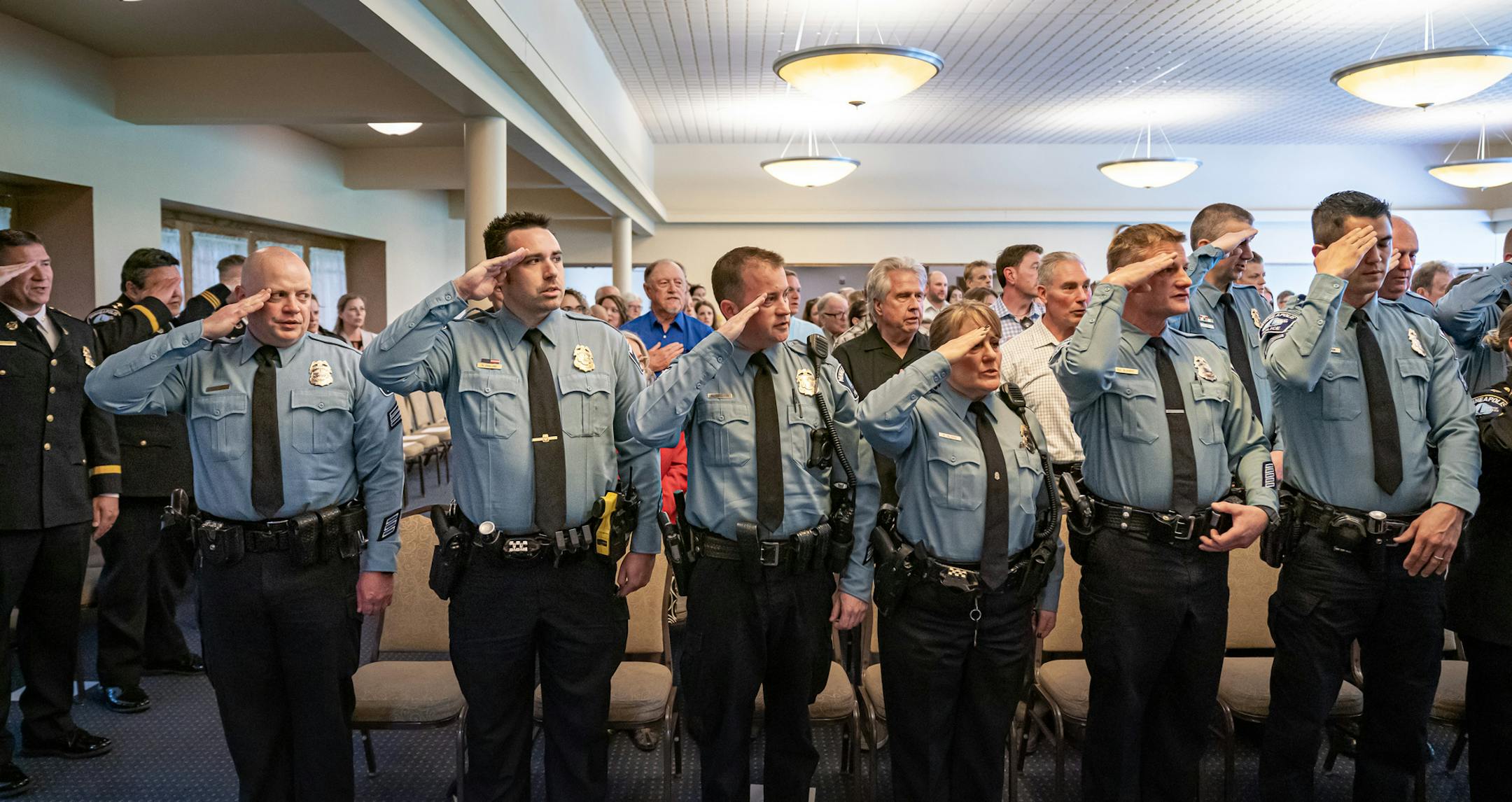 Saying the Pledge of Allegiance are some of the twelve new Minneapolis Police Department Sergeants. ] GLEN STUBBE • glen.stubbe@startribune.com Monday, June 3, 2019 The 2019 Minneapolis Police Department promotional ceremony was held at St. Mary's Greek Orthodox Church in Minneapolis. Promotions included Deputy Chef Kathy Waite, Inspectors Amelia Huffman and Kelvin Pulphus and Commander Katie Blackwell along with twelve new Sergeants.