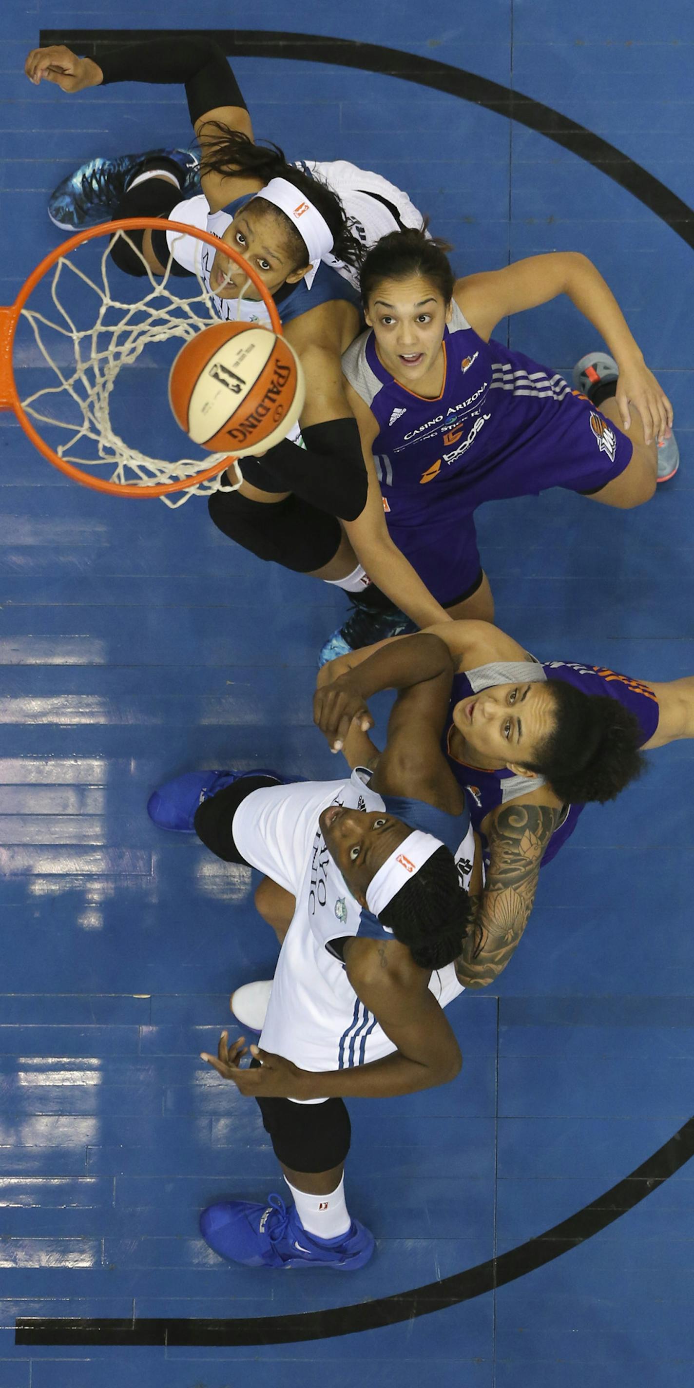 Lynx forward Maya Moore (23), top, and Lynx center Sylvia Fowles (34), bottom watched a first half shot drop Thursday night at Target Center. Defending were Phoenix Mercury forward Mistie Bass (8) and Phoenix Mercury forward Candice Dupree (4). ] JEFF WHEELER &#xef; jeff.wheeler@startribune.com The Minnesota Lynx began their Western Conference Final series with a 67-60 win over the Phoenix Mercury in an WNBA game Thursday night at Target Center in Minneapolis.