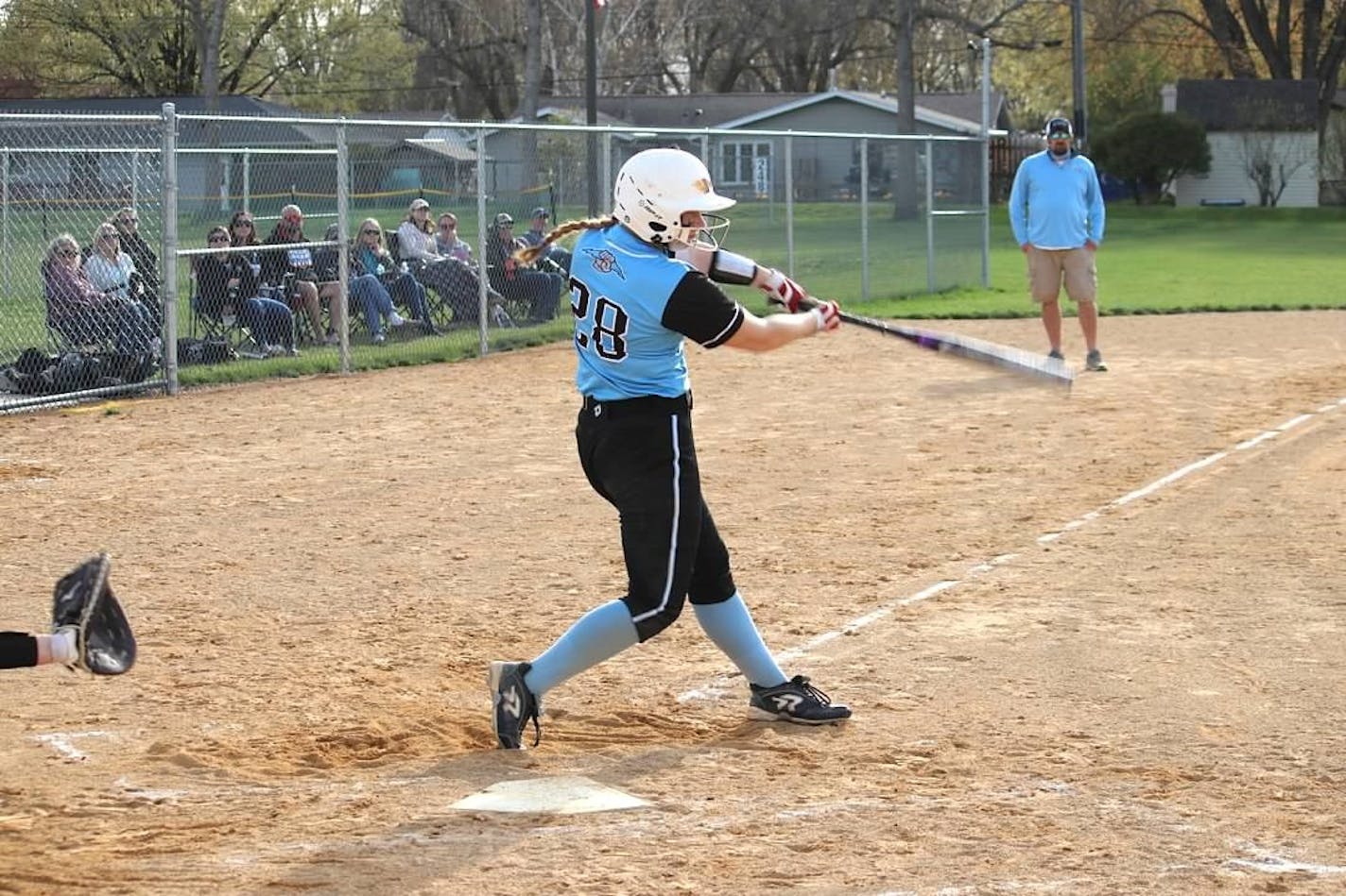 Tri-City United's Elliana Novak unleashes a big swing in a recent Titans' game.