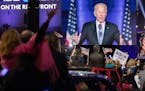 An audience reacts as President-elect Joe Biden speaks after winning the presidential election, Wilmington, Del., Nov. 7, 2020. As he addressed the na