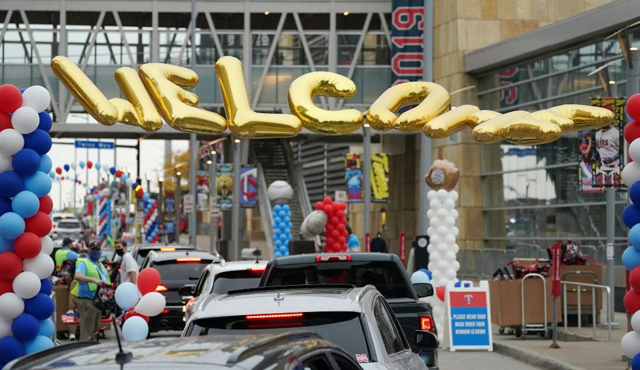 Minnesota Twins fans lined up in their cars for a Fan Appreciation Drive-Through Parade ahead of the Twins game against the Cincinnati Reds Saturday outside Target field.
