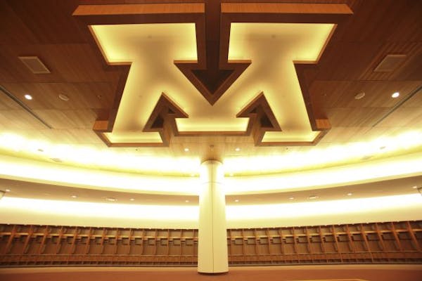 The illuminated "M" logo on the ceiling of the Gophers' locker room at the University of Minnesota.