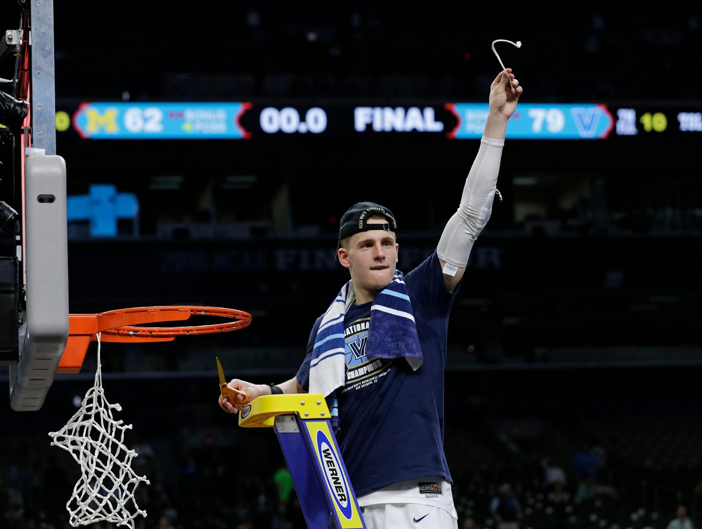 Villanova's Donte DiVincenzo cuts the net as he celebrates after the championship game of the Final Four NCAA college basketball tournament against Michigan, Monday, April 2, 2018, in San Antonio. Villanova won 79-62. (AP Photo/David J. Phillip)