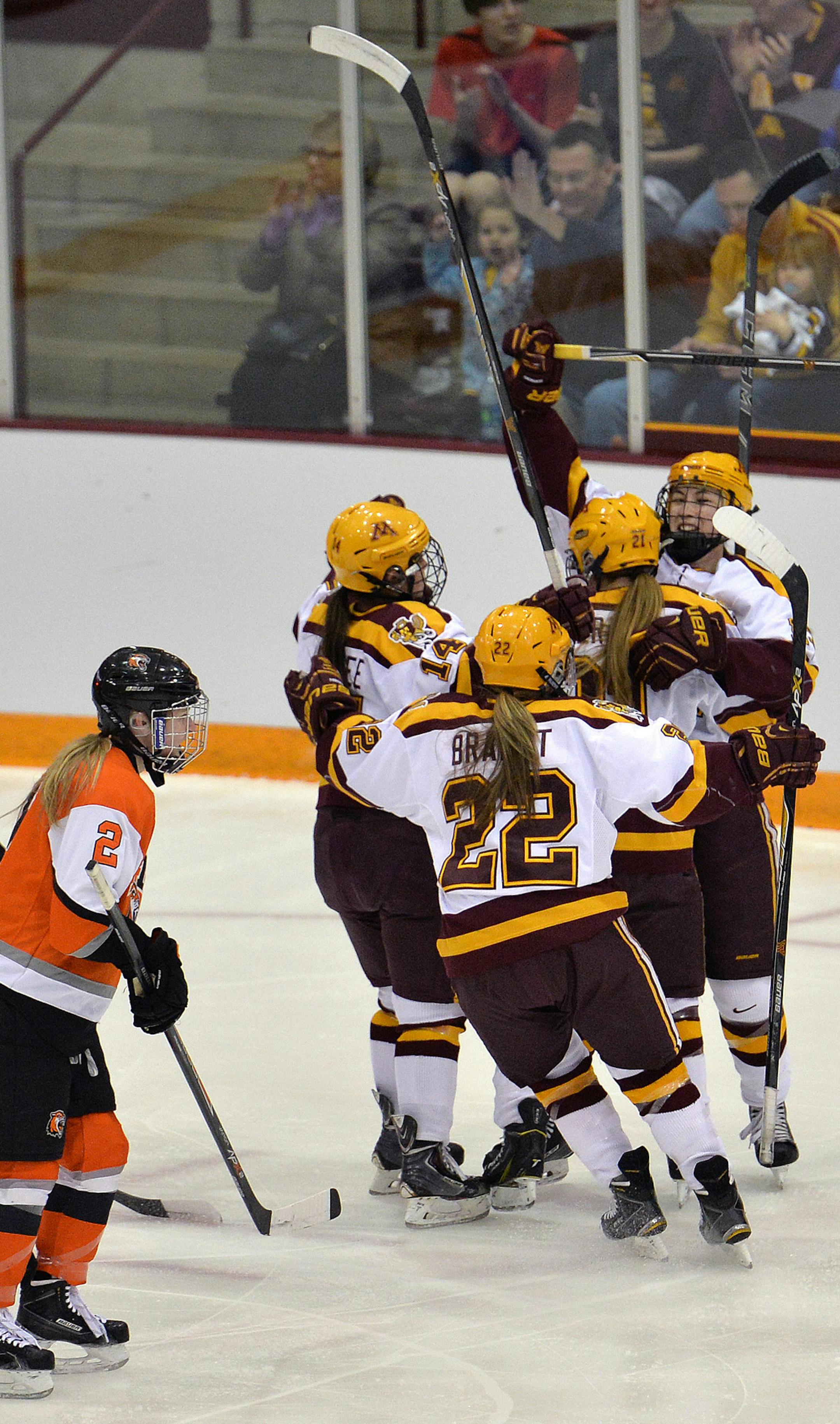 Minnesota celebrates the first goal of the game shot by junior Milica McMillen during the first period of the NCAA quarterfinal game Saturday, March 14 at the University of Minnesota's Ridder Arena. Minnesota led RIT, 3-1 at the end of the period. ] (SPECIAL TO THE STAR TRIBUNE/BRE McGEE) **Milica McMillen (MN, 13)