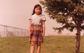Contributing columnist Ka Vang at 6 years old, roughly one year after arriving in the United States as a refugee.